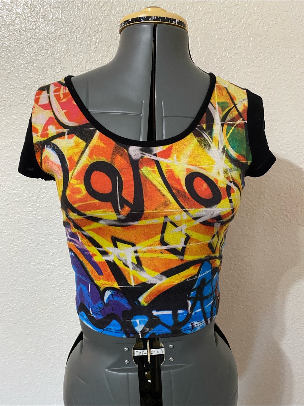Wet Seal Graffiti Print Crop Top in Black, Orange & Blue